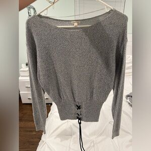 Silence + Noise grey long sleeve sweater top with black tie detail at bottom
